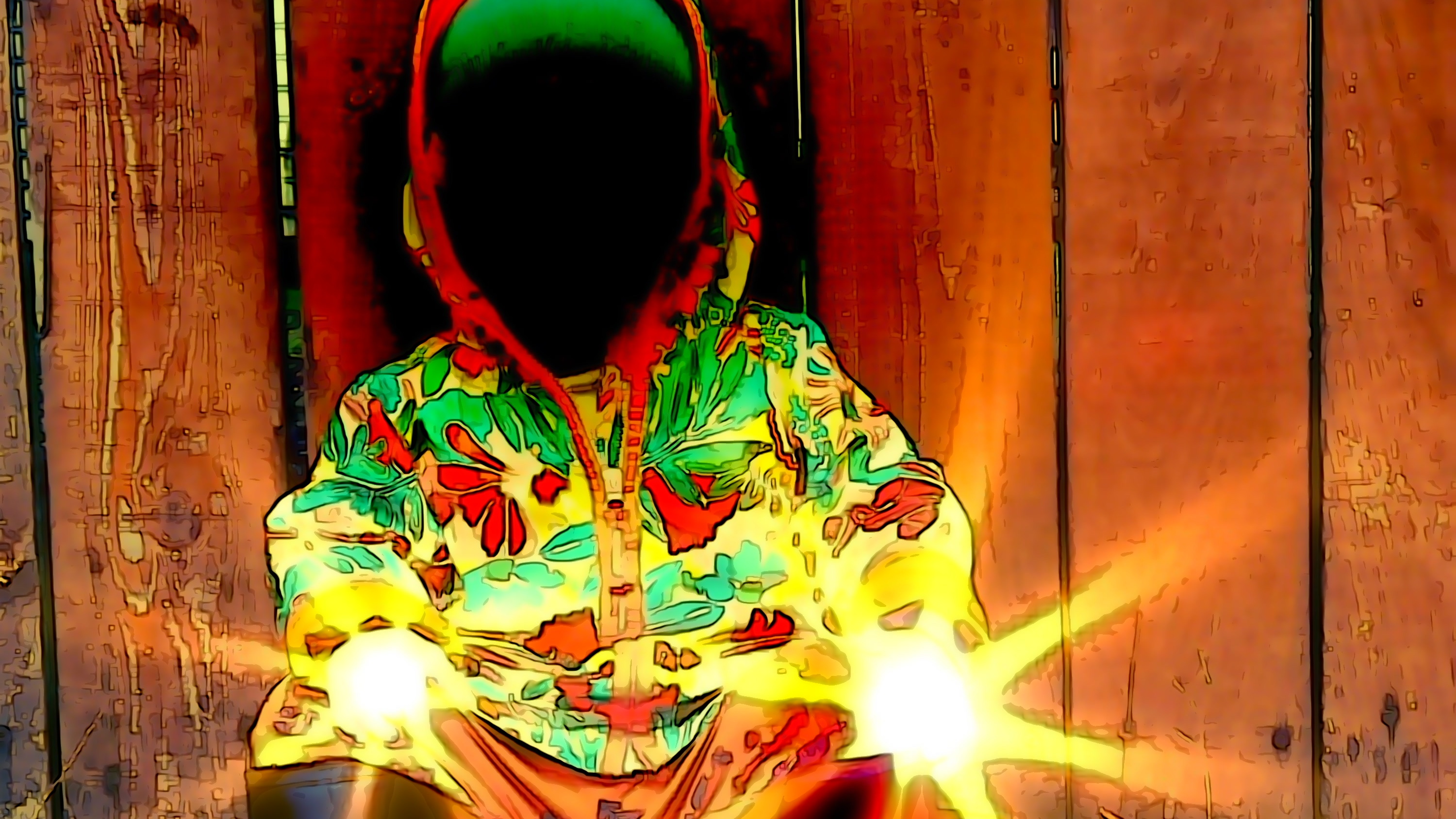 Person wearing a colorful hoodie sitting against a wooden wall with glowing effects.